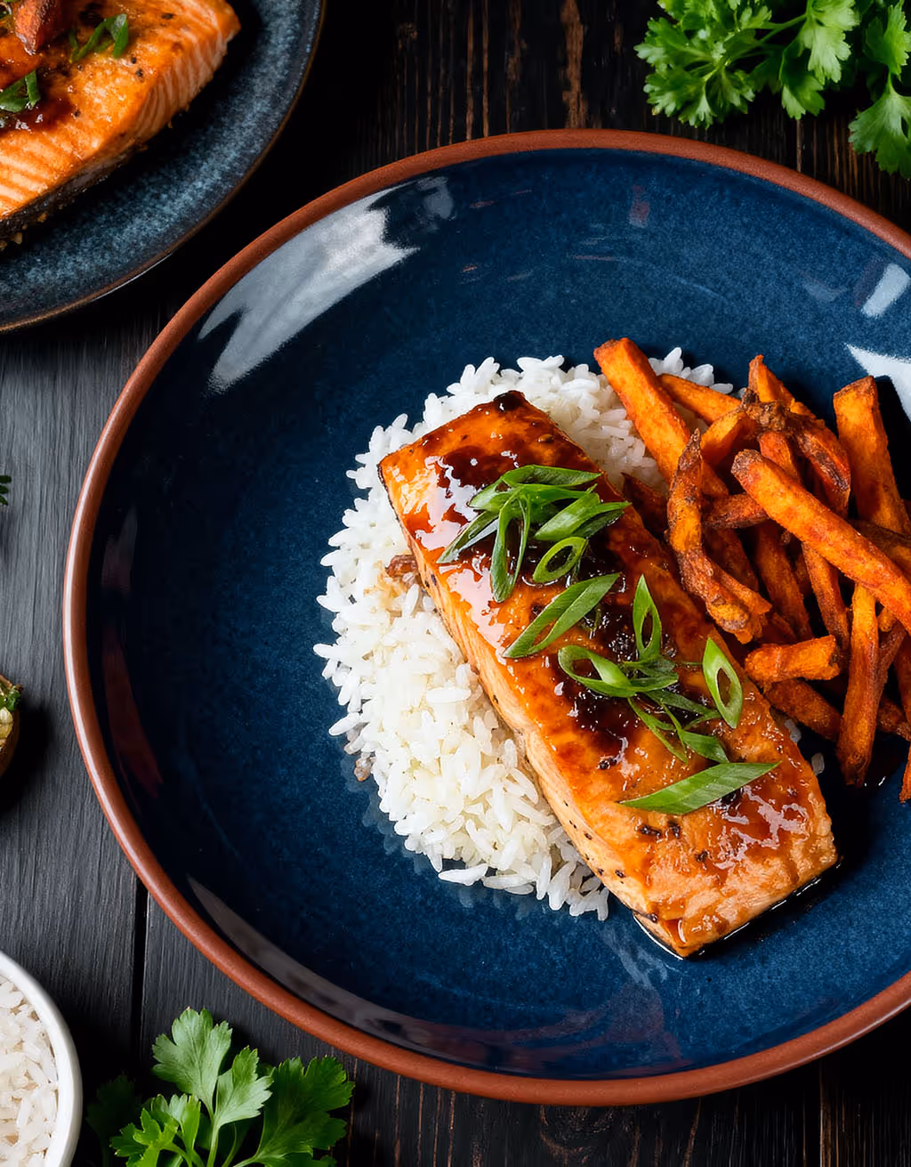 Close-up of seafood paella with shrimp, green peas, red peppers, and mussels in a large pan.
