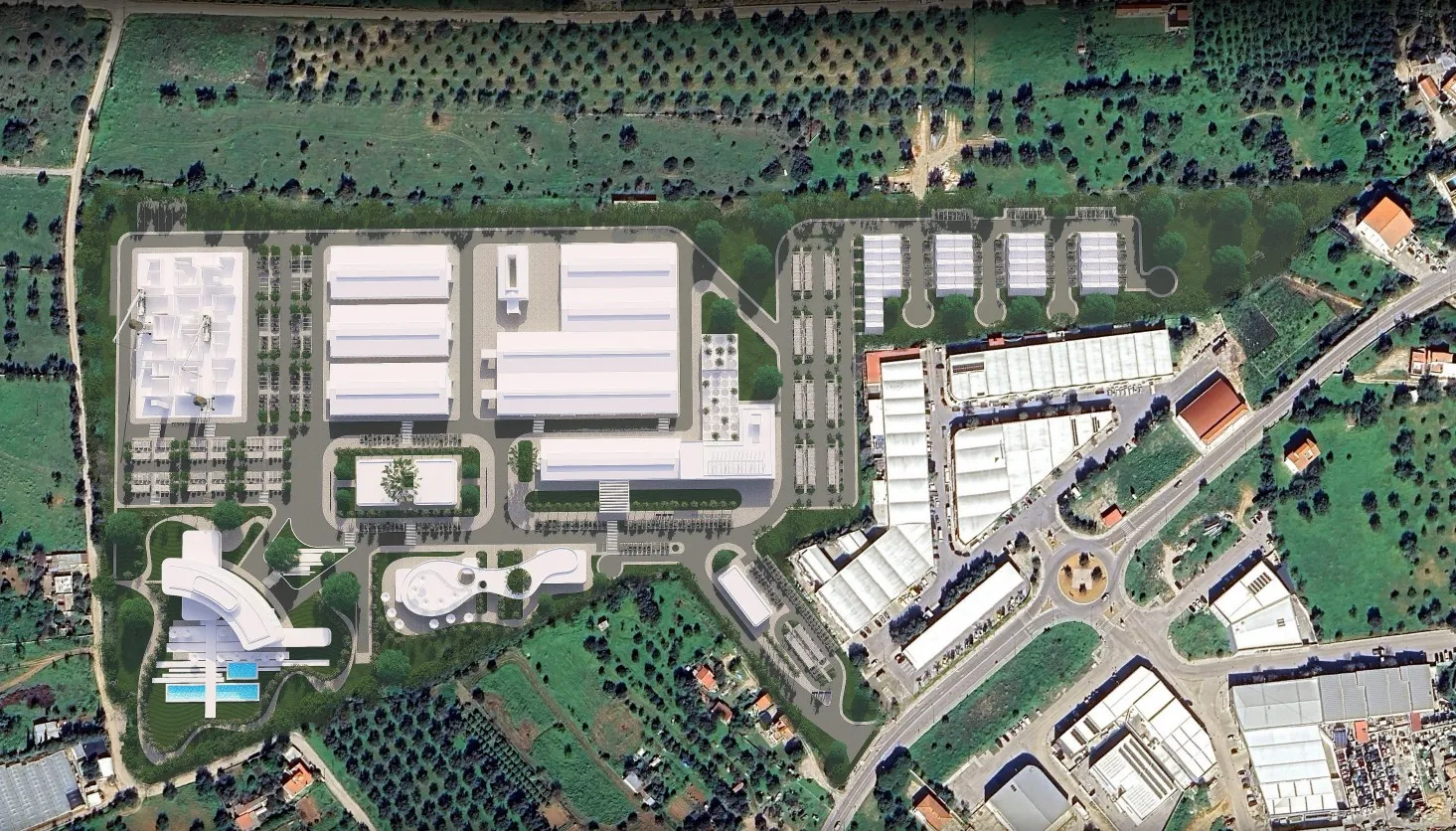 Aerial view of an industrial complex with multiple white-roofed buildings, roads, and surrounding greenery.