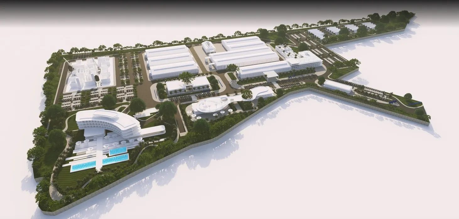 Aerial view of a large modern campus with multiple buildings, parking lots, pools, and green landscaping.