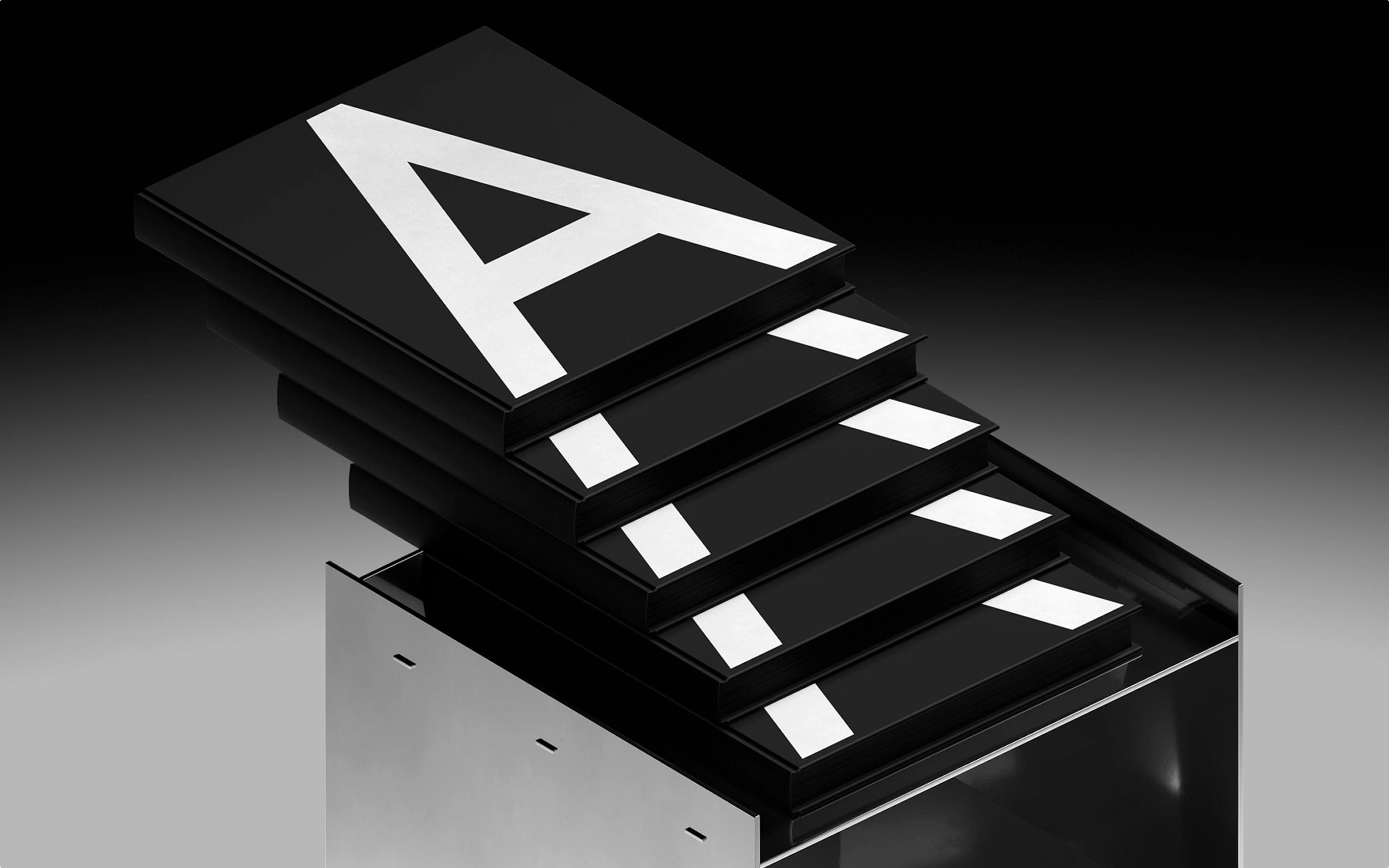 A stack of black and white signs displaying the letter "A" prominently on each sign.