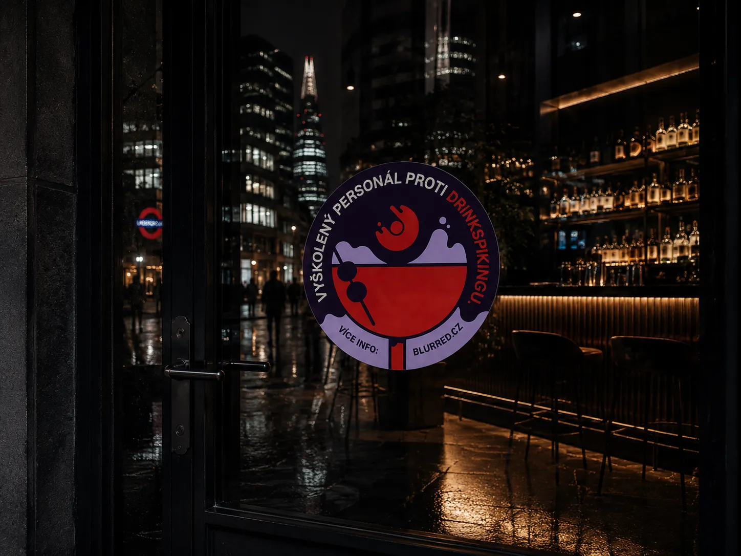 Sign on glass door with text about trained staff against drink spiking in a night city bar setting.