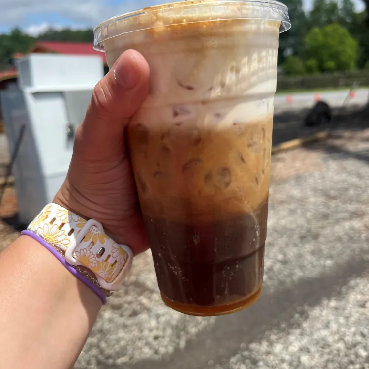 A refreshing iced coffee drink with layers of cream and coffee.
