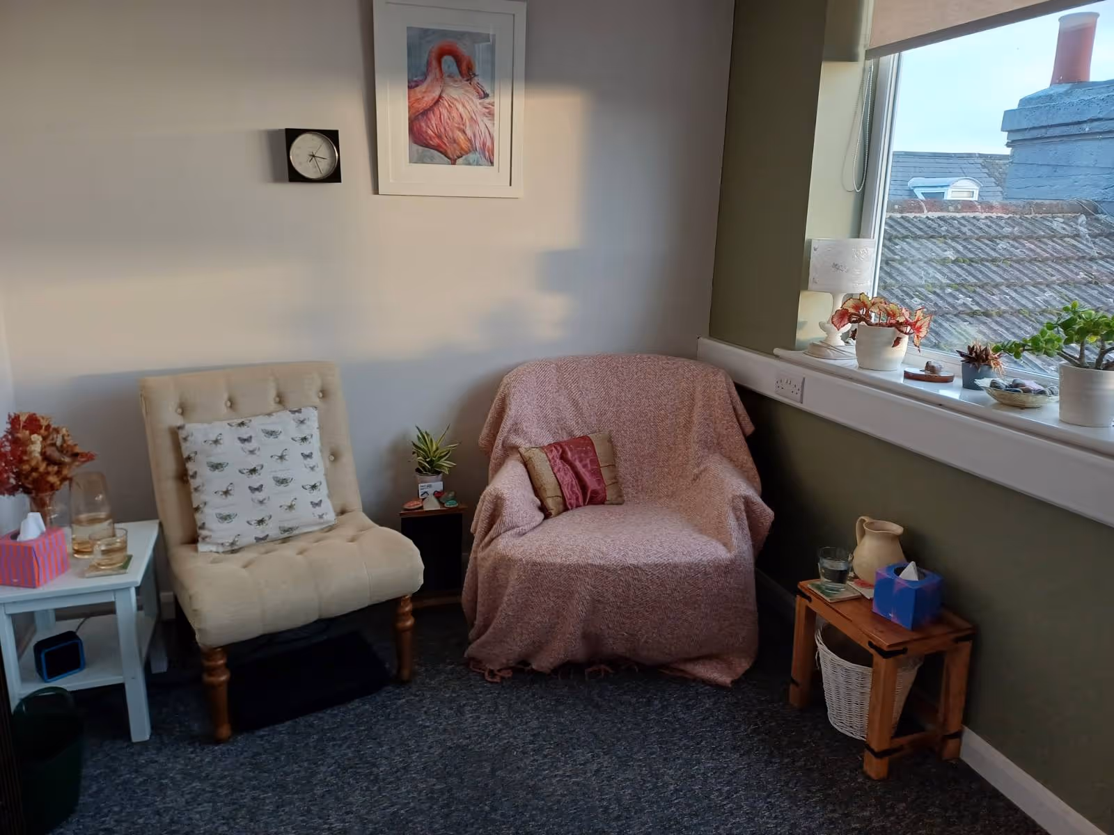 Light-filled therapy room in Littlehampton, West Sussex, with cosy seating and plants, creating a safe environment for integrative counselling and psychotherapy.