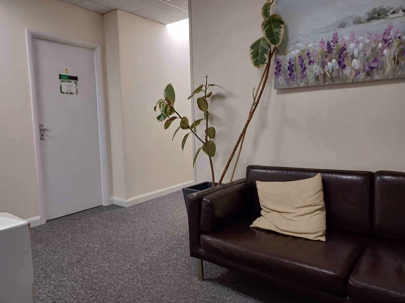 Comfortable waiting area in a Littlehampton counselling practice, offering a calm space for clients before their integrative therapy session with Caroline Neilson.