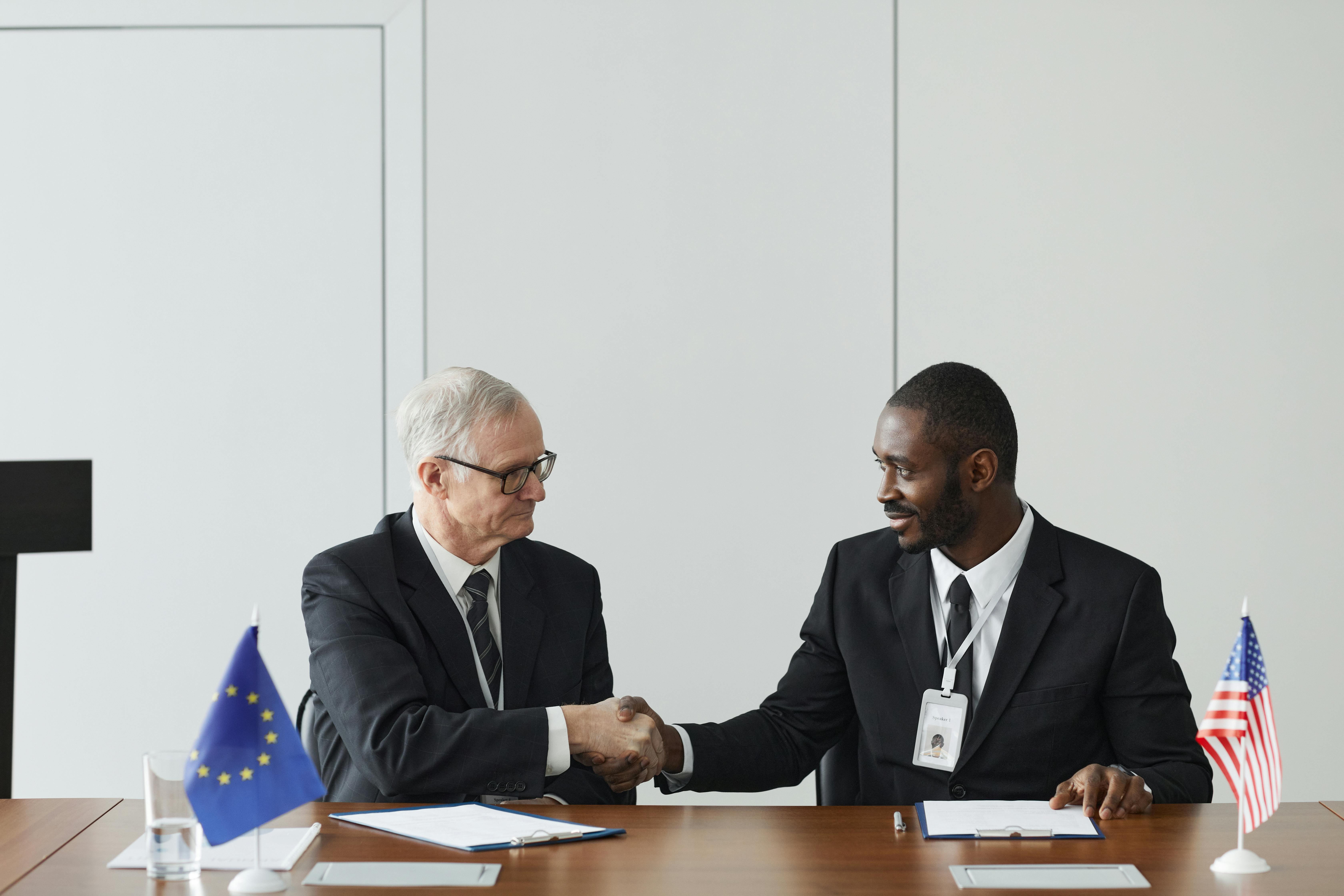 International business leaders shaking hands to seal a U.S. market-entry deal