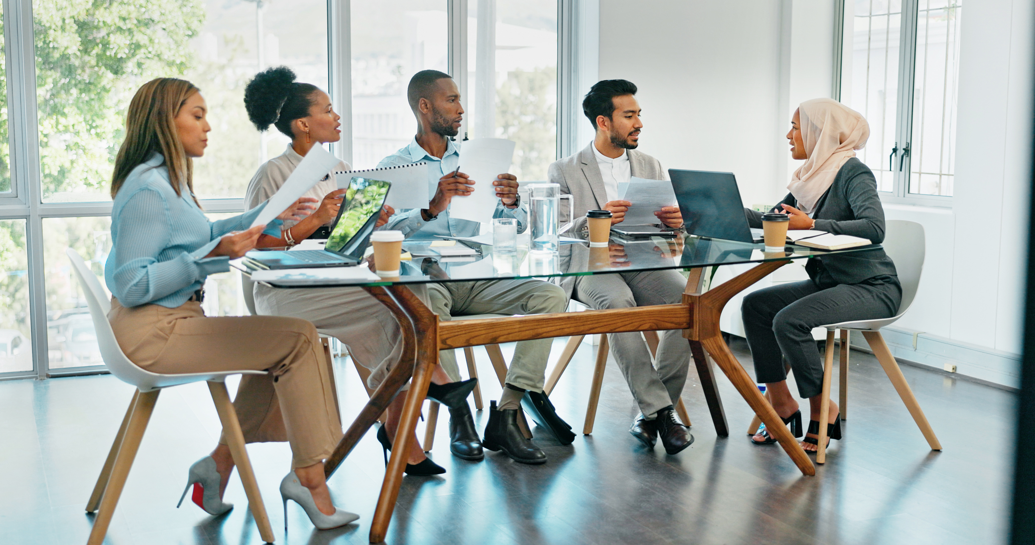 Business team in a boardroom discussing sales strategy for U.S. expansion