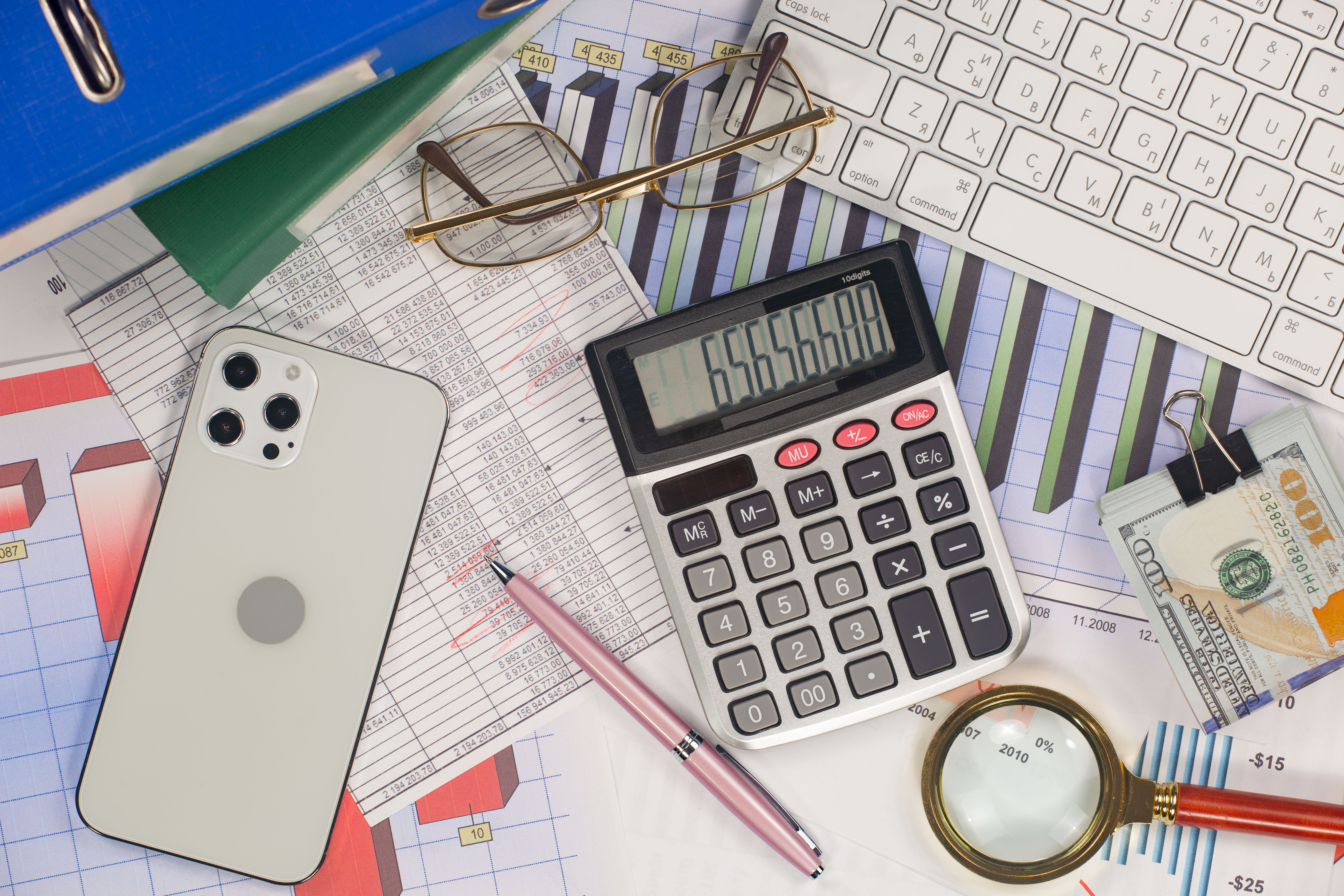 Calculator and financial documents representing B2B lead generation costs