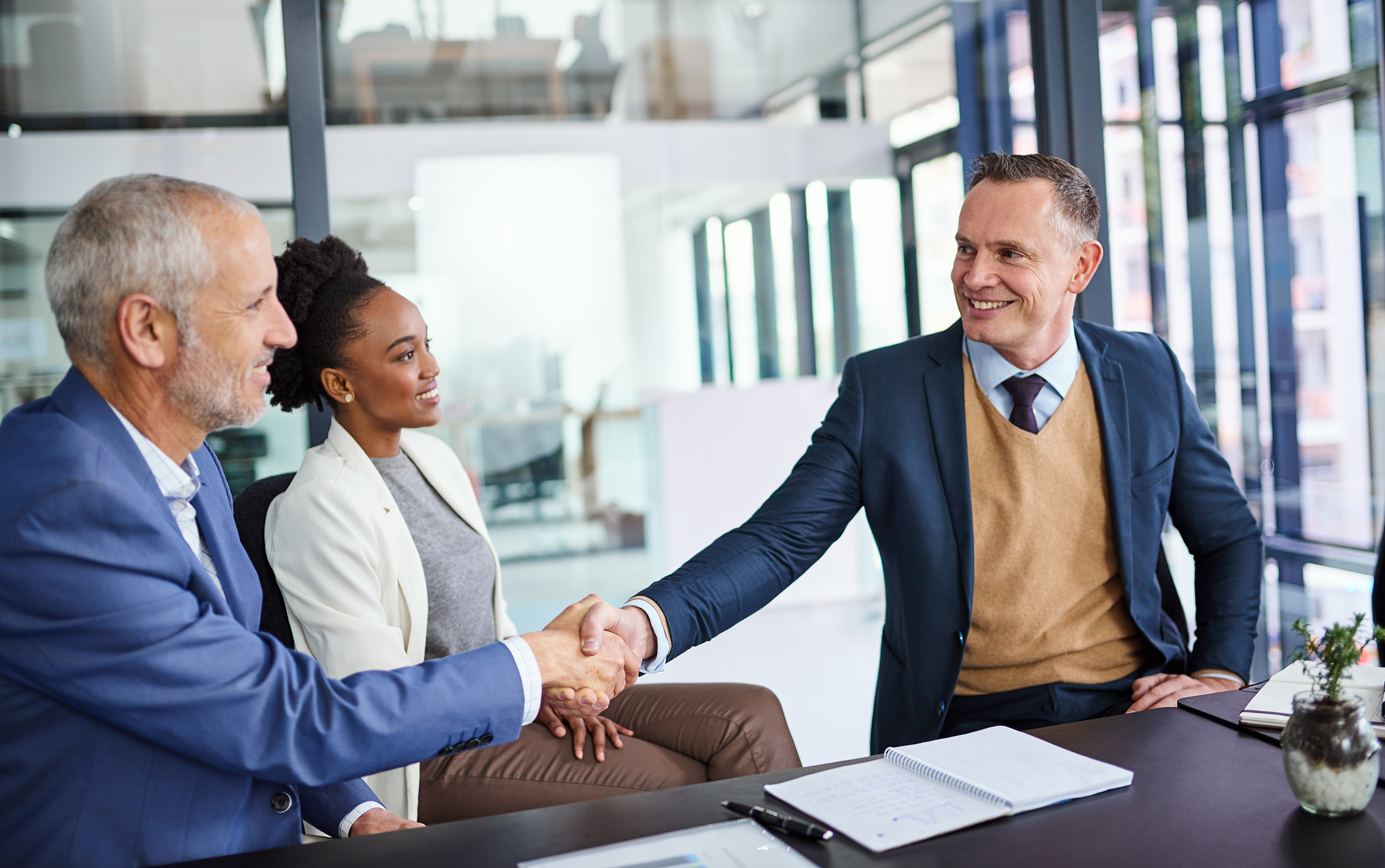 International business team shaking hands on a Latin America deal