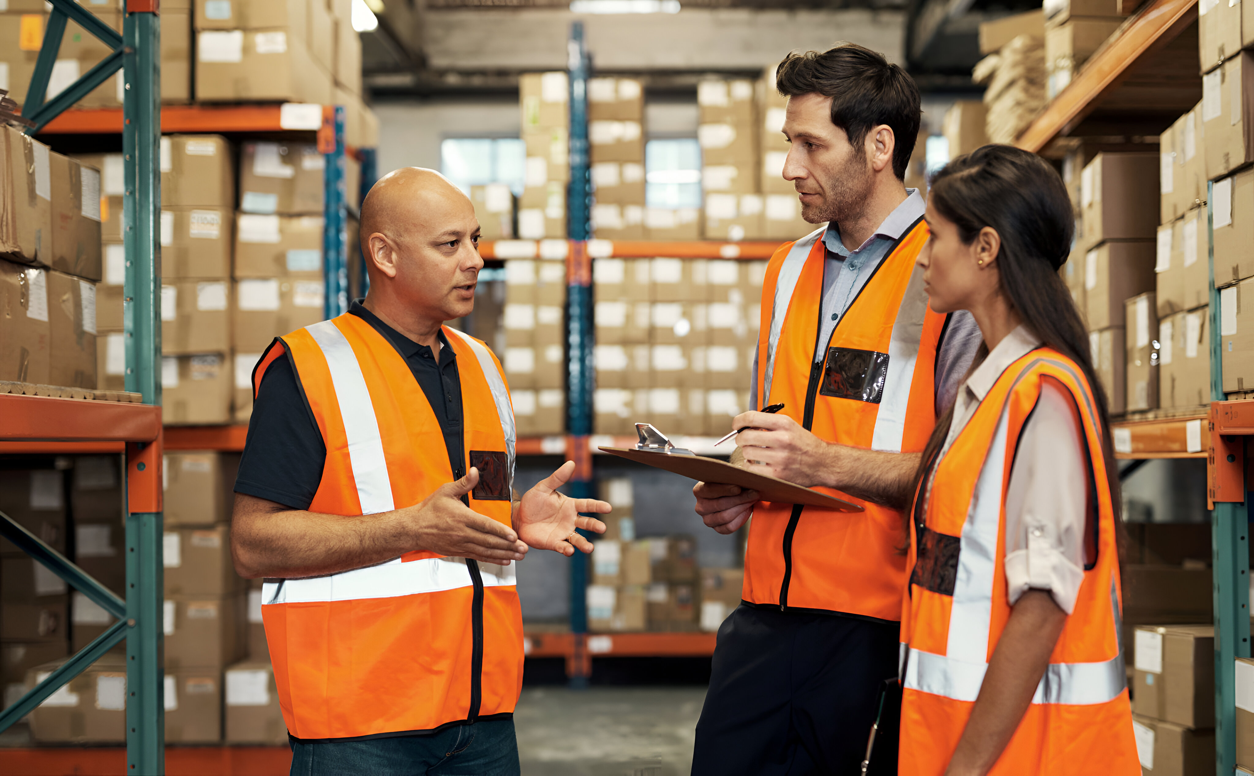 Team reviewing supplier and manufacturing options in a warehouse