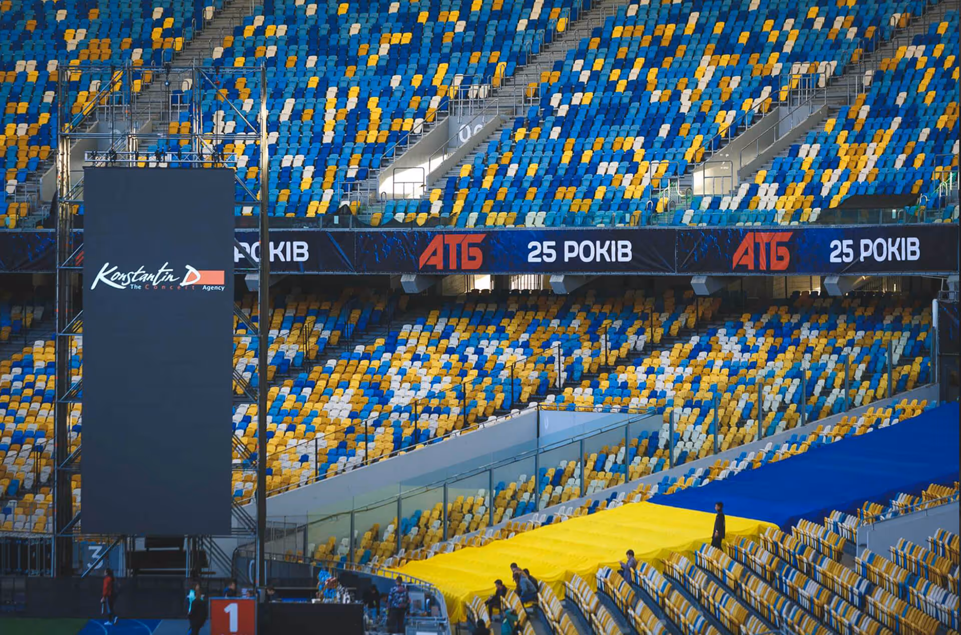 Empty stadium with stage and screens before concert