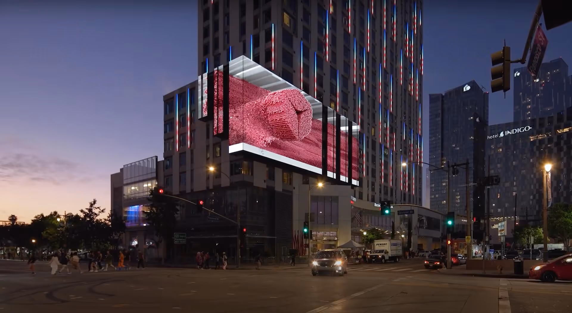 Close-up view of the LED billboard animation in Los Angeles, with the logo partially emerging from the 3D scene.