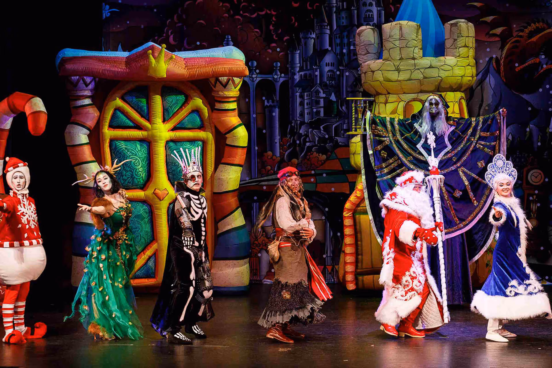 Actors dressed as characters from Ukrainian New Year fairy tales dancing on stage