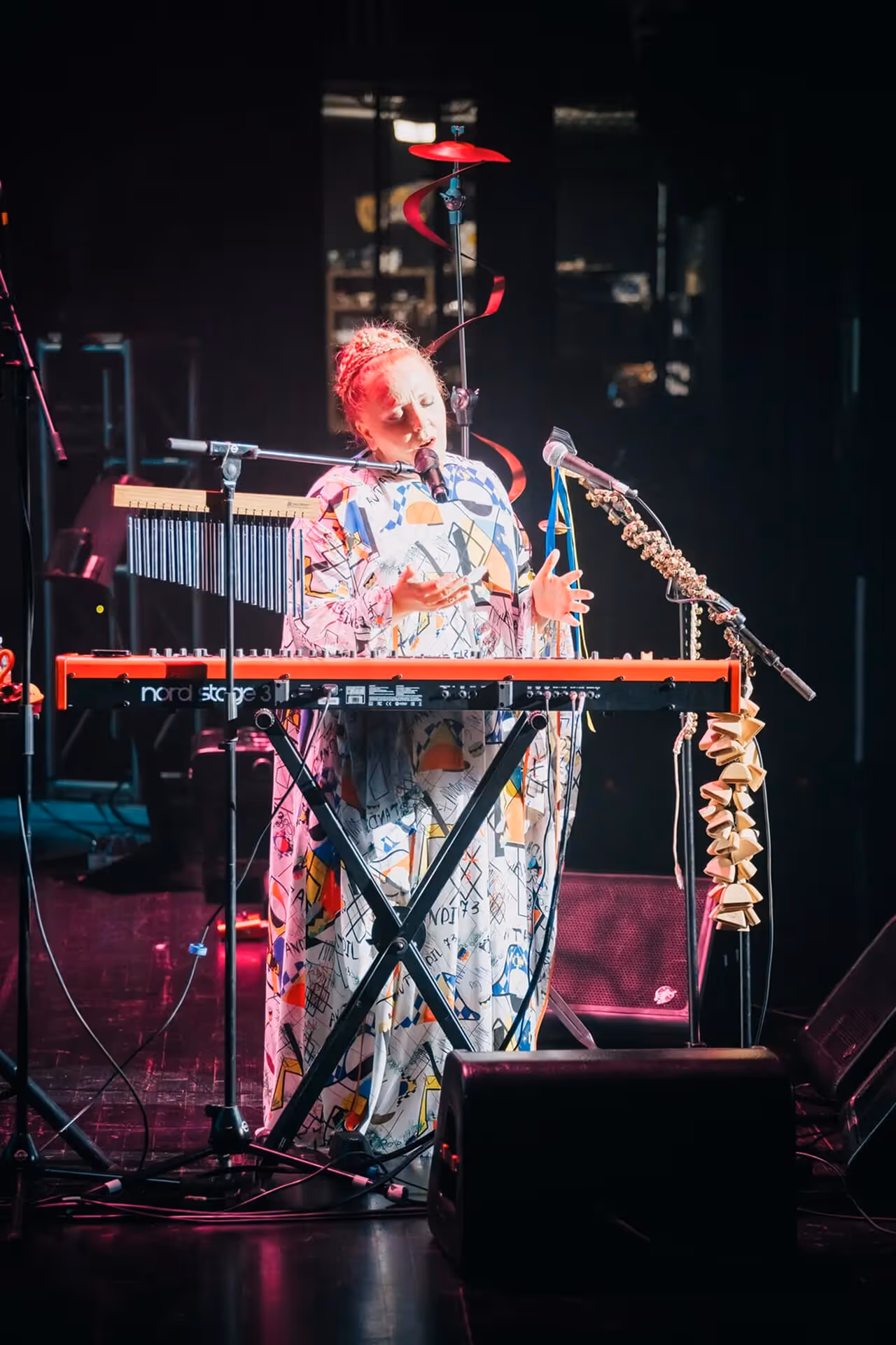 Nino Katamadze playing keyboard with saxophonist in concert setting