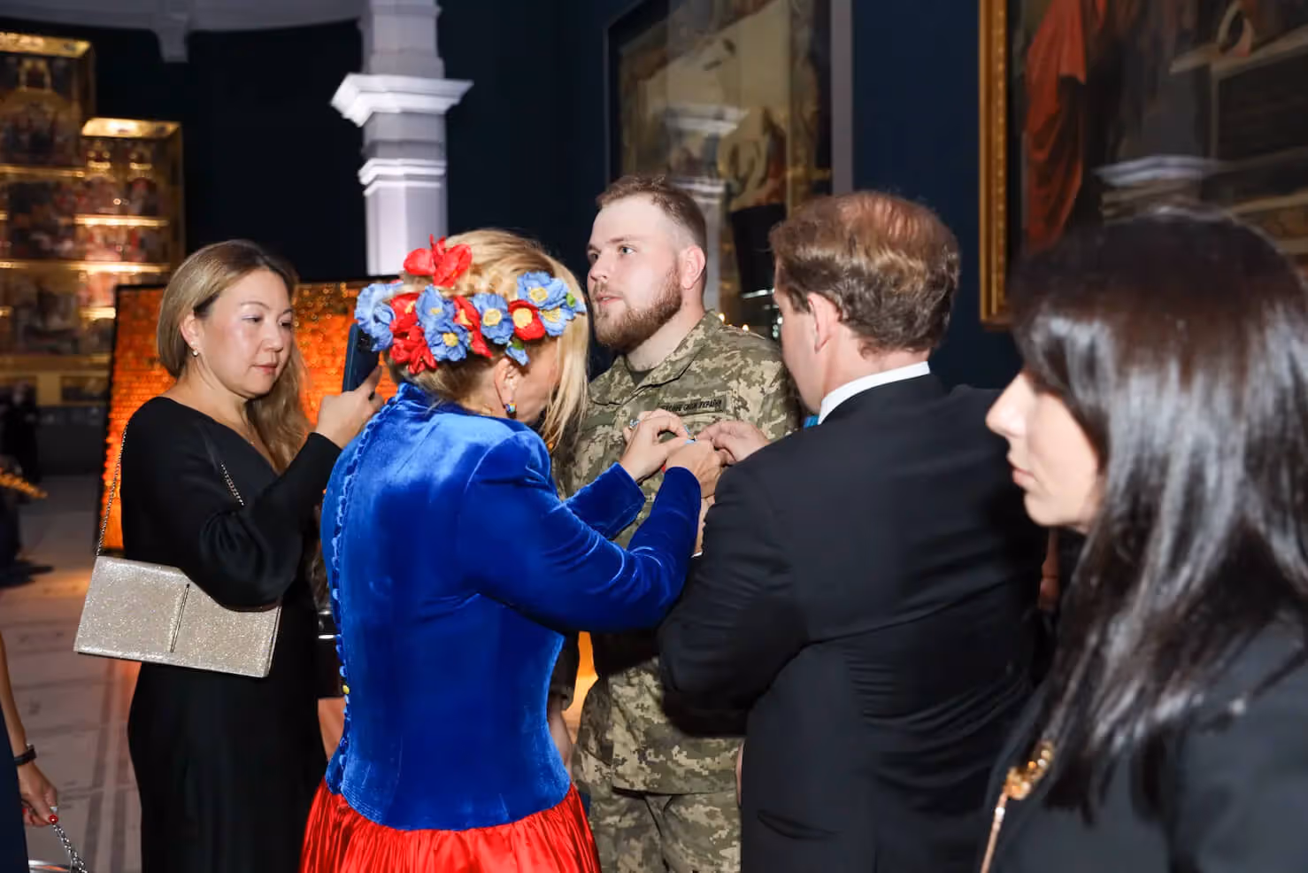 Ukrainian soldier receiving award at charity gala auction