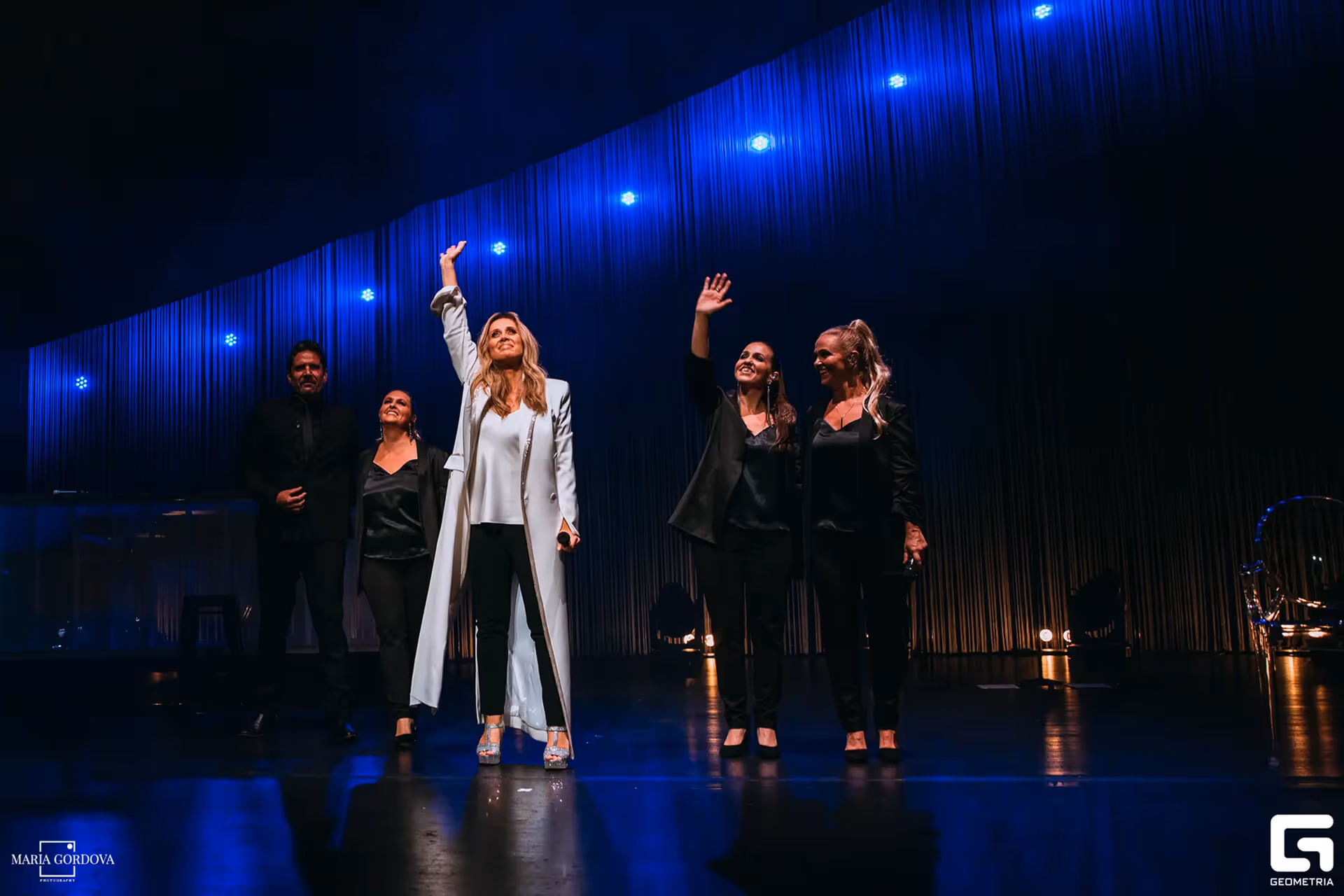 Lara Fabian on Dolby Theatre stage in shimmering dress with cheering fans