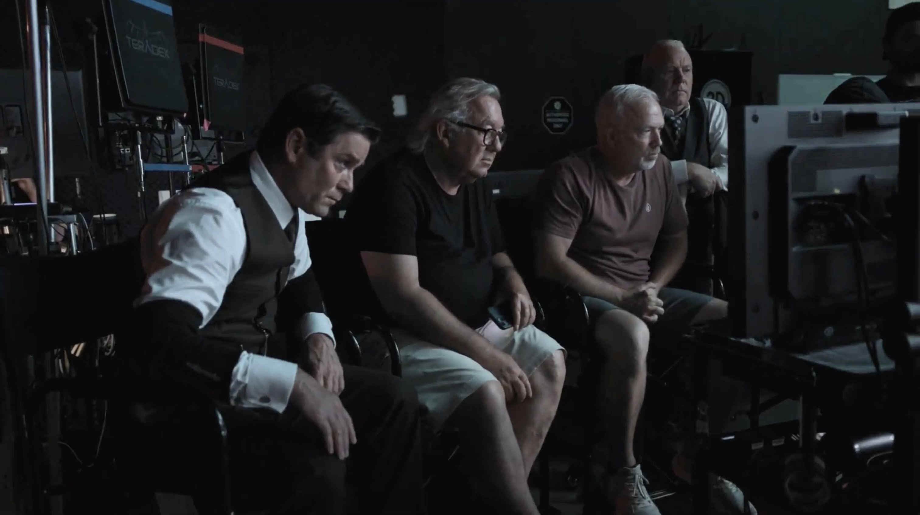 Cast and crew watching playback at video village during the virtual production shoot