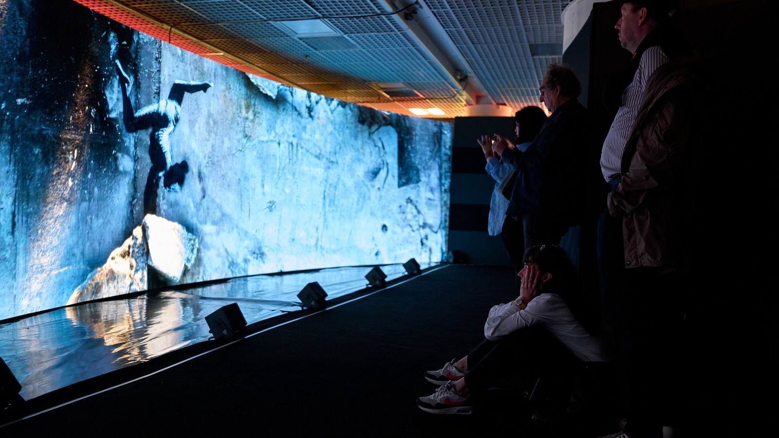 Visitors at the Murals immersive installation at Cannes, 2023