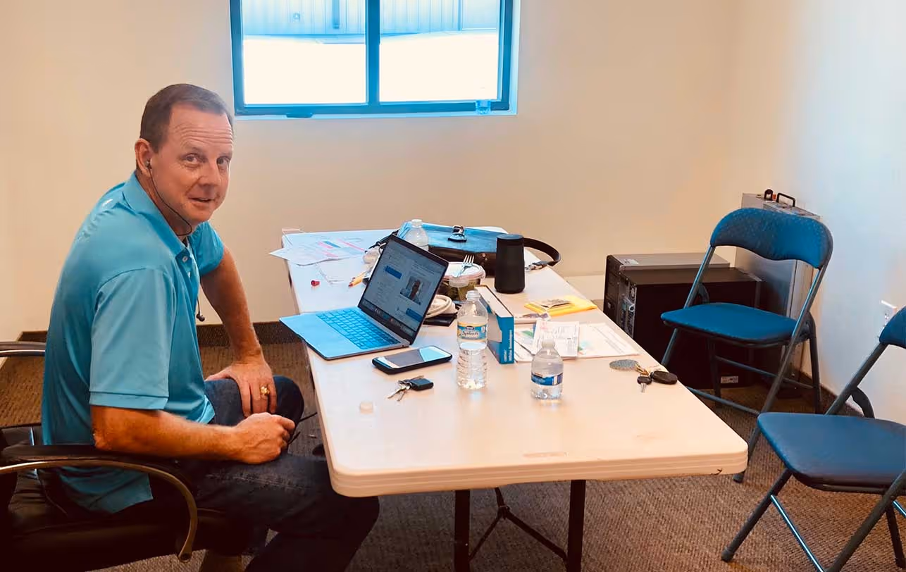 John Albers sitting in his first office