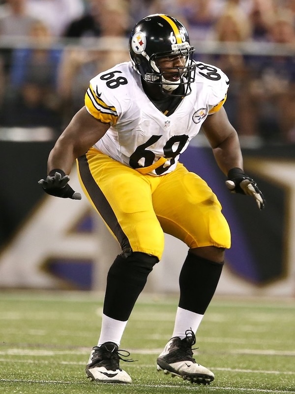 Kelvin as a Pittsburgh Steelers football player in number 68 jersey preparing for a play on the field.