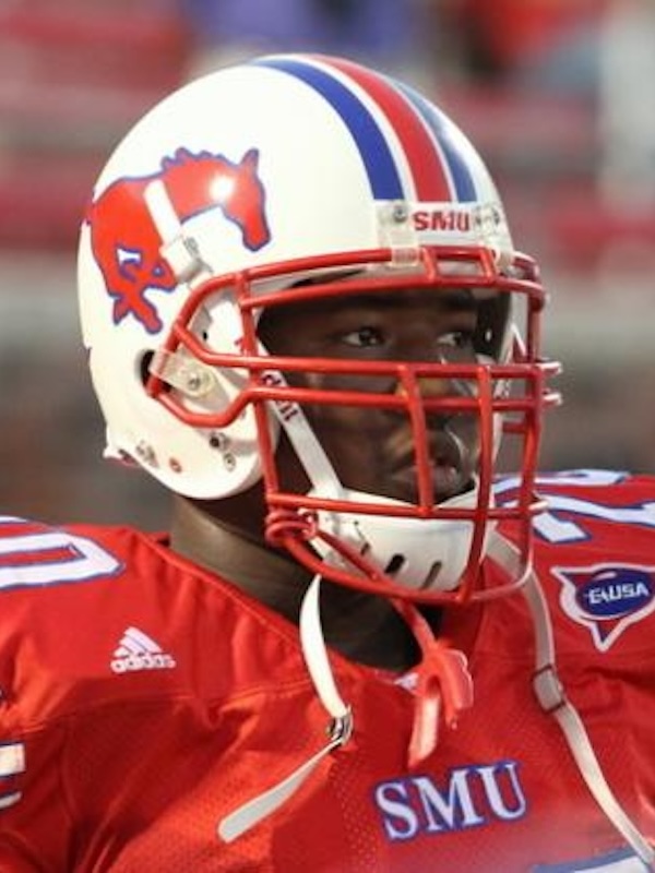Kelvin wearing a red SMU jersey and white helmet with red and blue stripes and a red mustang logo.