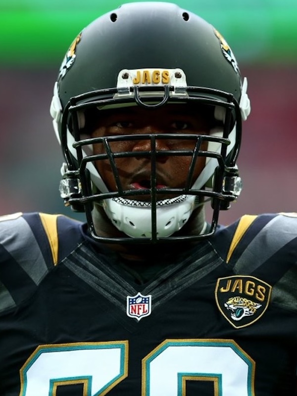 Close-up of Kelvin wearing a Jacksonville Jaguars helmet and jersey with the number 20.