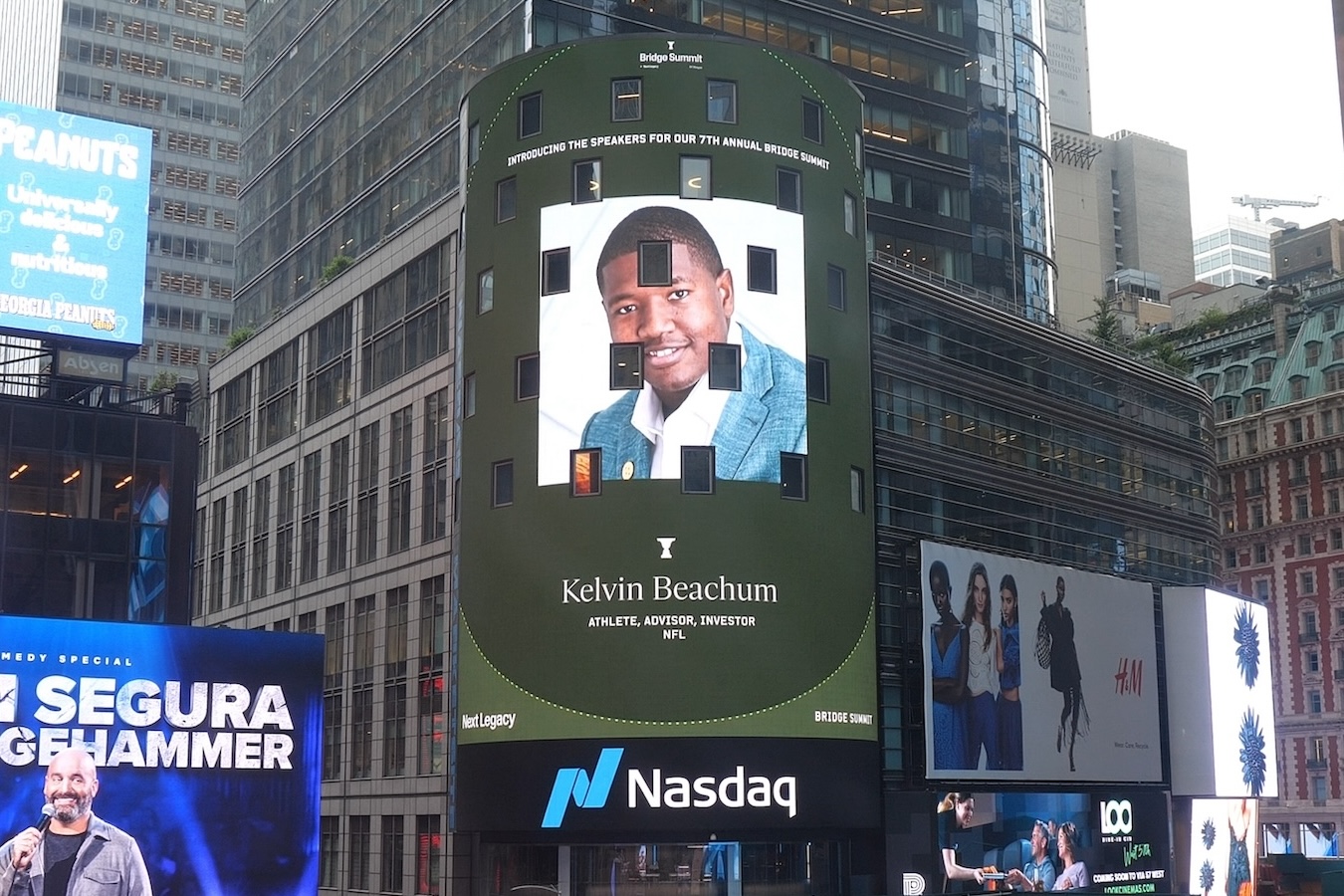 Times Square digital billboard featuring Kelvin Beachum, labeled as athlete, advisor, investor, NFL, with Nasdaq logo below.