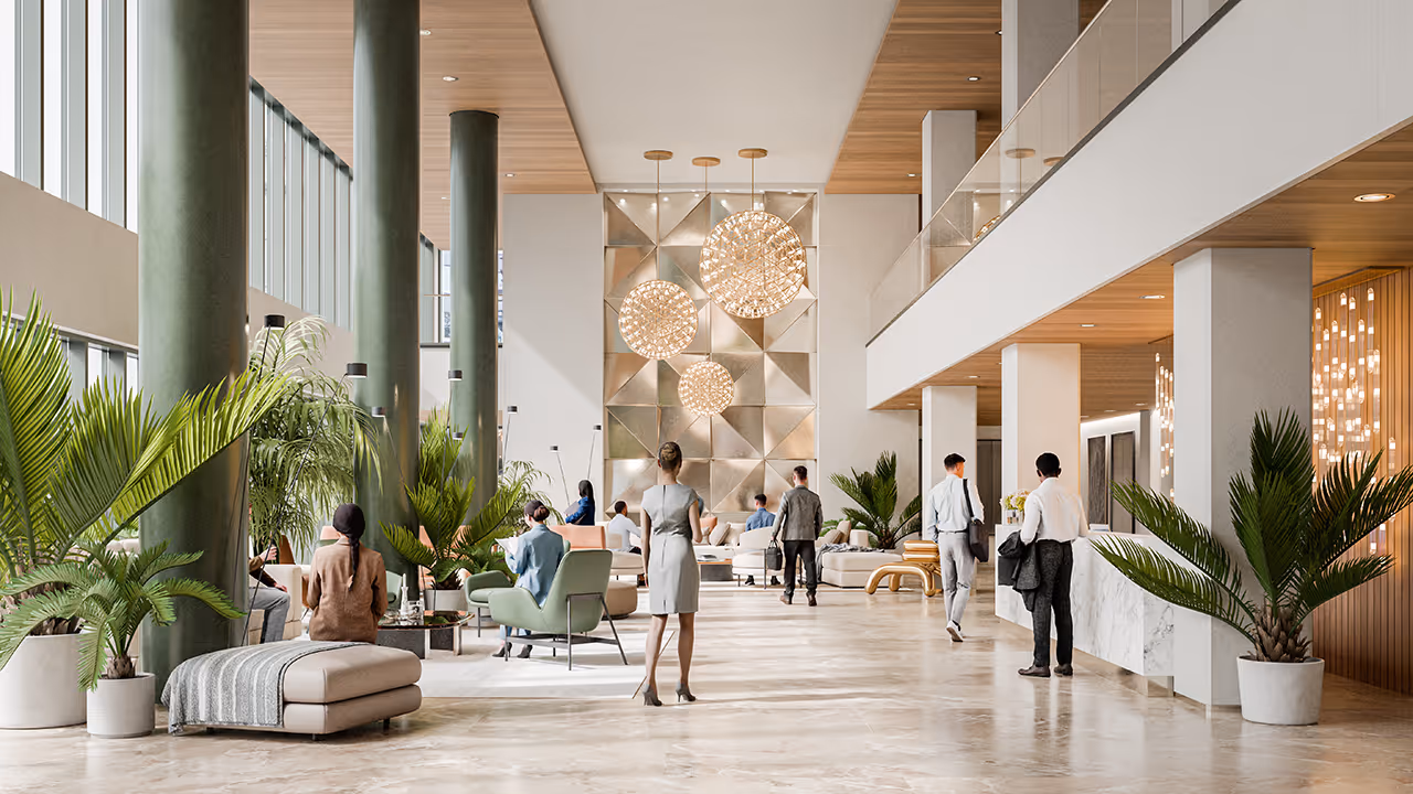 Modern, bright lobby with green columns, plants, and elegant spherical chandeliers