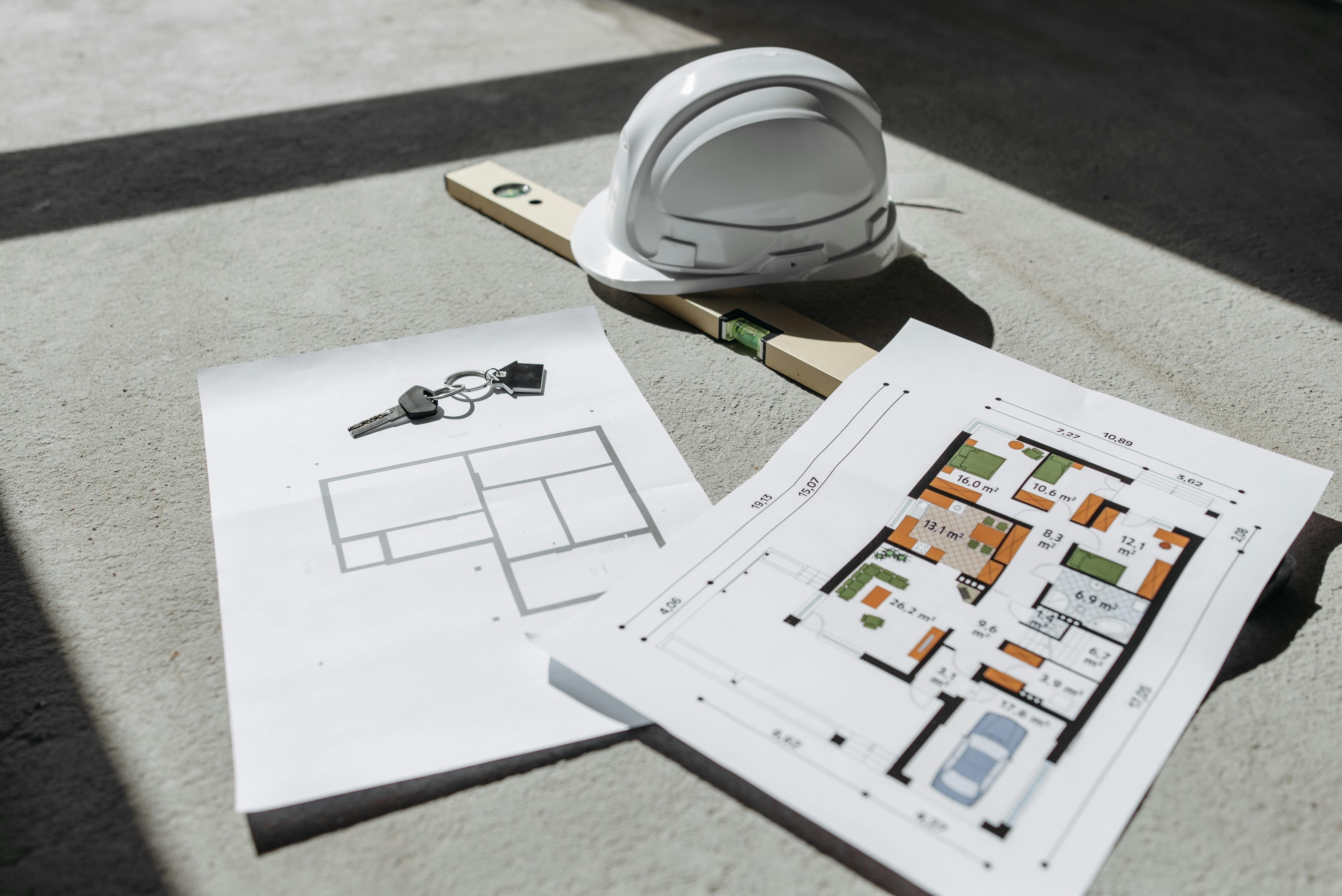 plans and construction helmet together