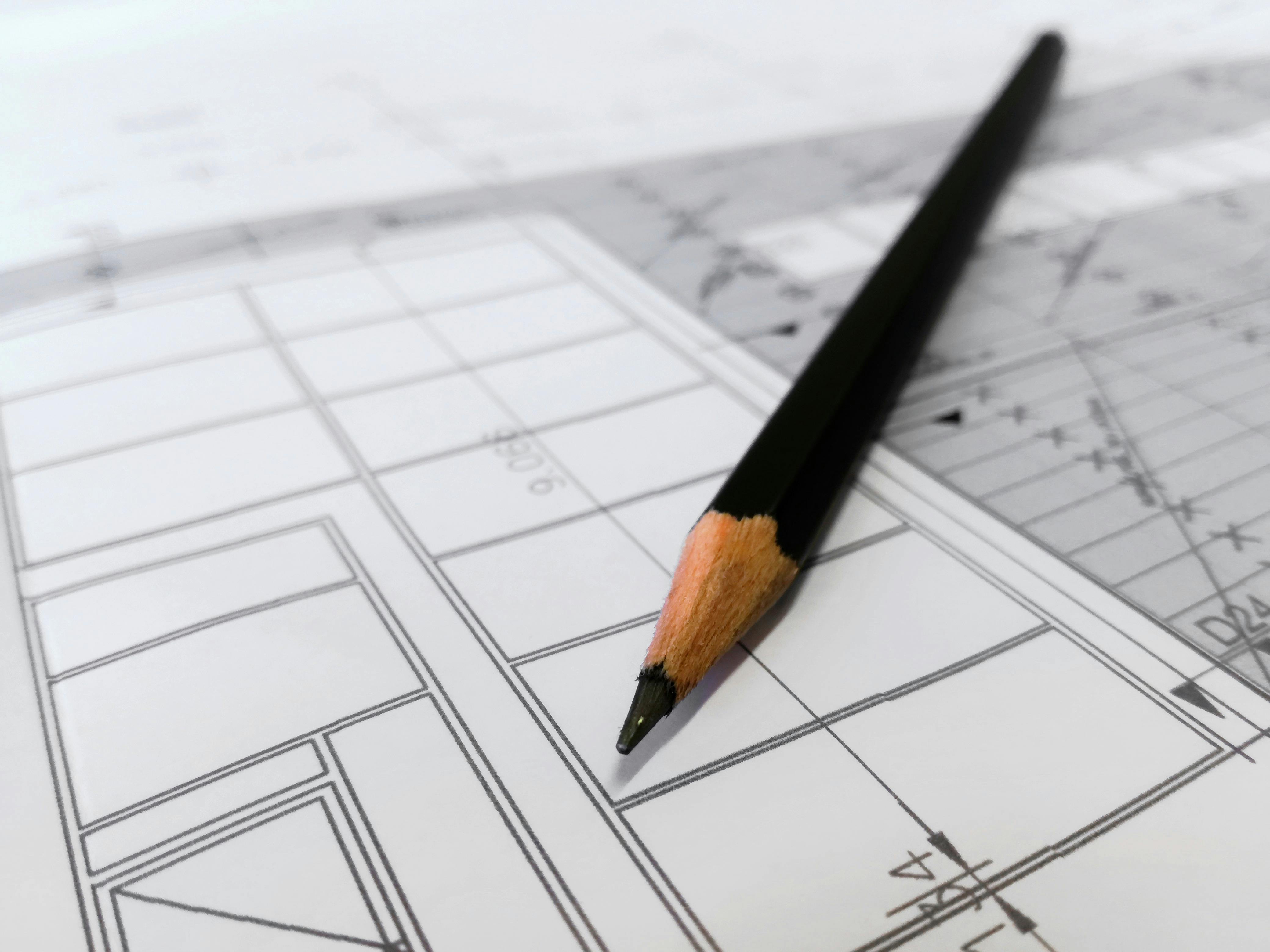 plans and helmet on blueprints