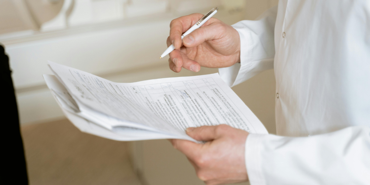 Hand with pen checking their HOA Winter Prep Checklist off