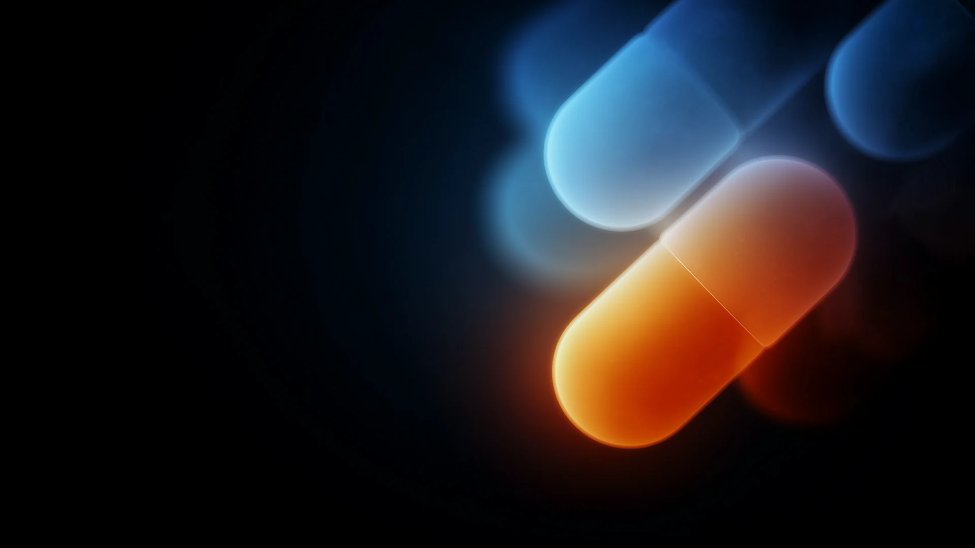 Glowing capsules, one blue and one orange, floating against a dark background.