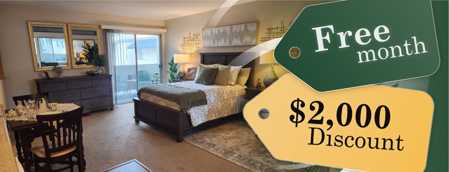 Promotional banner of a furnished bedroom with 'Free month' and '$2,000 Discount' price tags