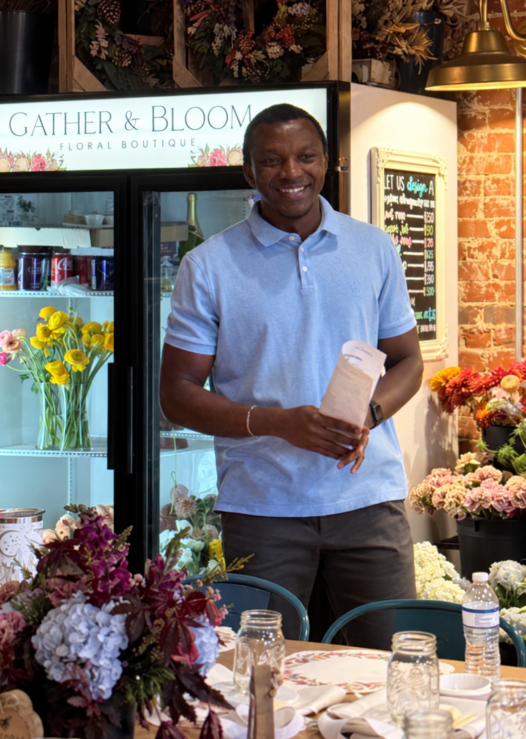 Dr. Ossai, founder of FindMyPeds, at the Babies & Bloom community event.