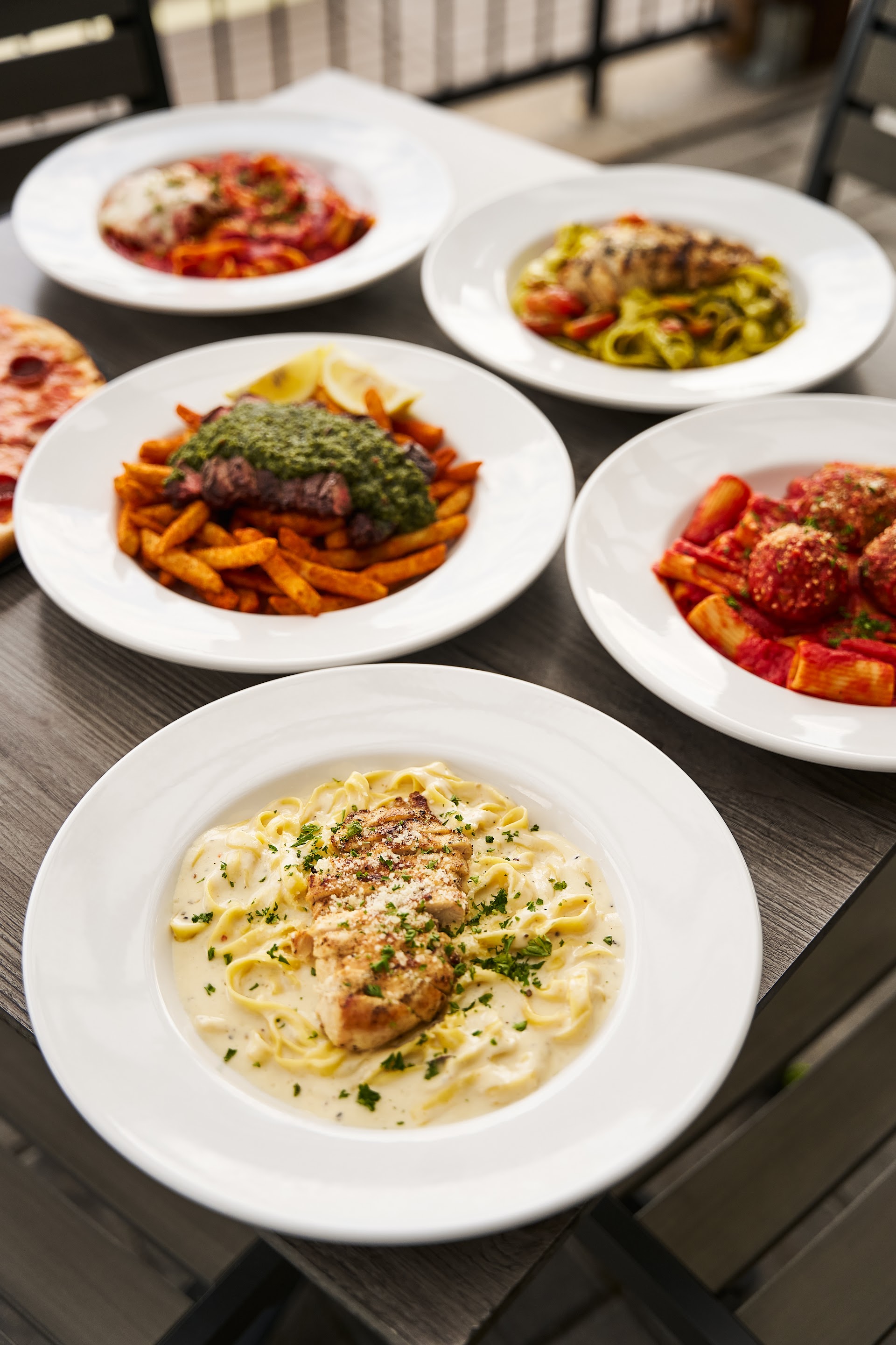 A spread of pasta dishes on Bella Vista's waterfront patio