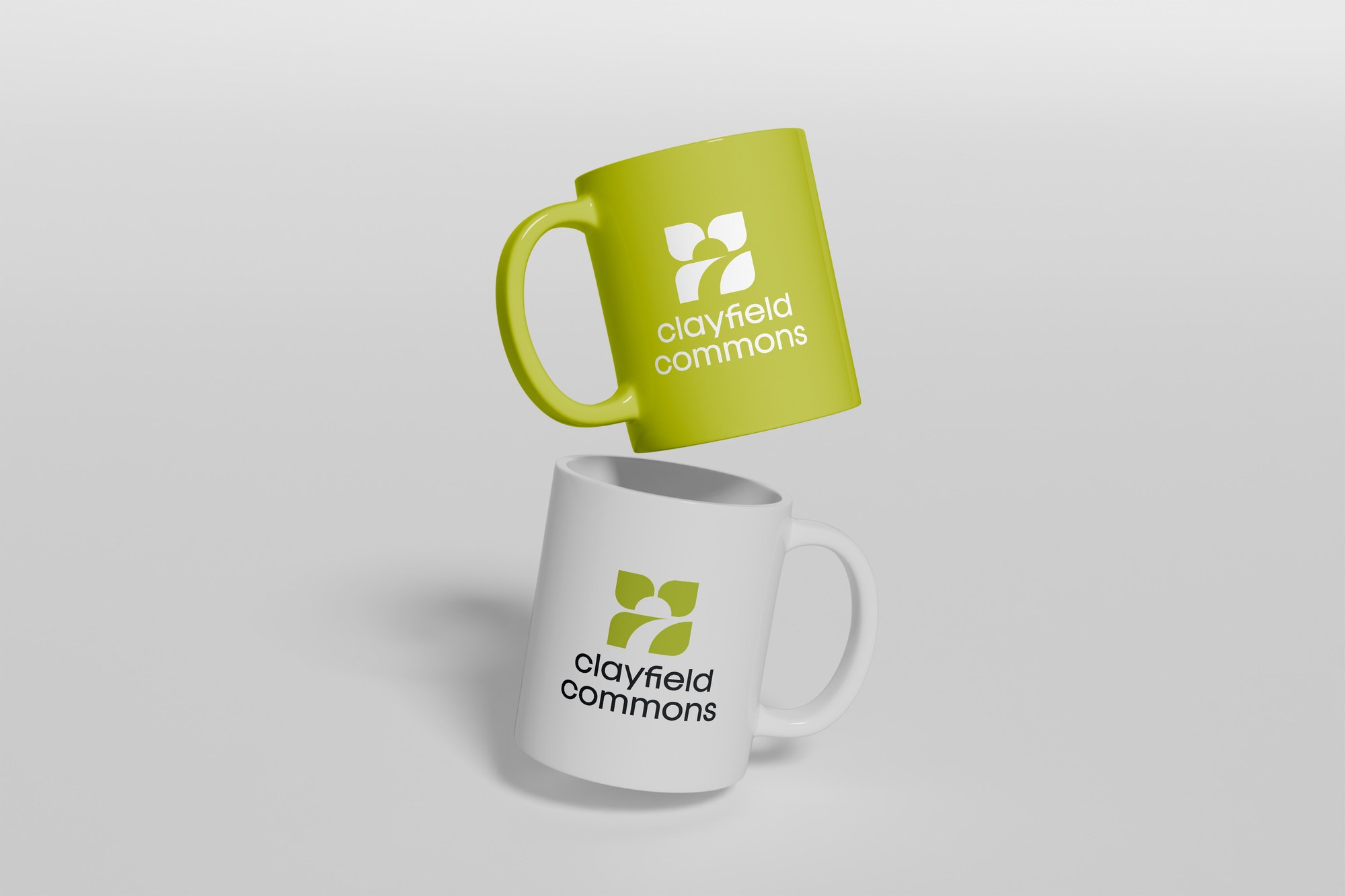 Clayfield Commons branded mugs in Field Olive and white