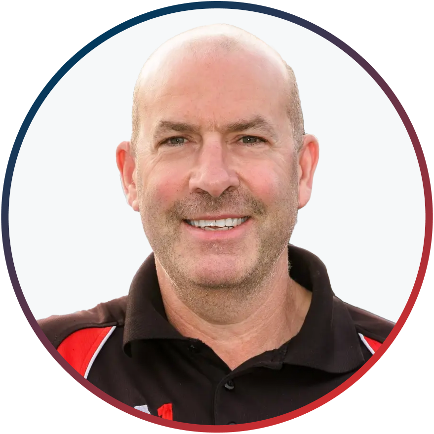 Professional headshot of a smiling man in a black and red collared shirt
