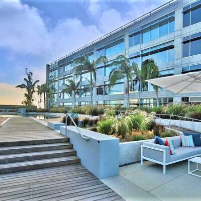 Outdoor seating and landscaped terrace at Water’s Edge office complex in Playa Vista, CA
