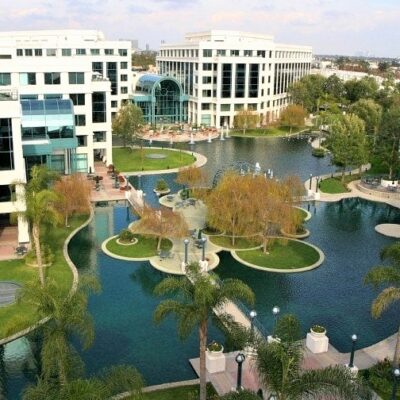 Aerial view of Water Garden office complex with landscaped lake and fountains in Santa Monica, CA