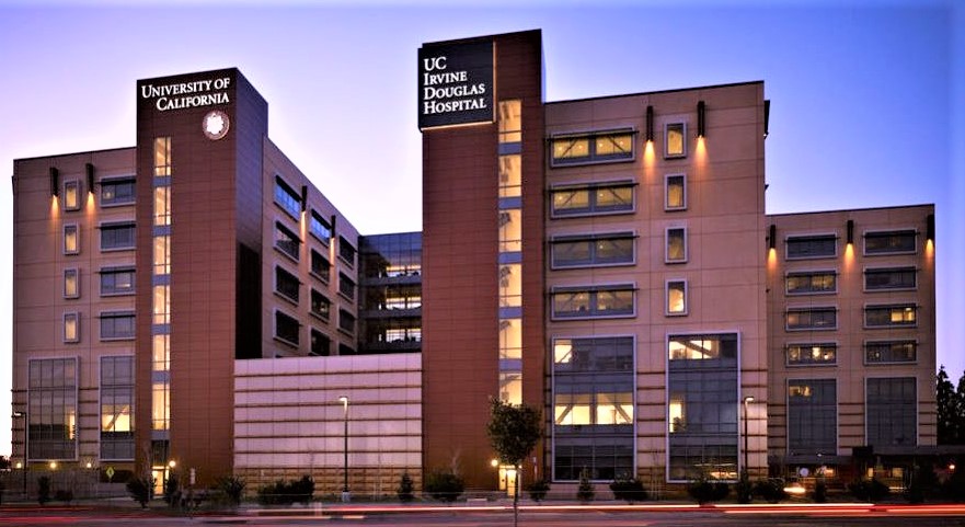 Exterior view of Hoag Hospital in California at sunset, showing modern glass façade and high-rise architecture.