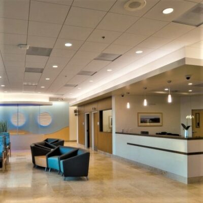 Hospital reception area with seating and modern lighting