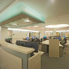 Nursing station with computer workstations and overhead lighting