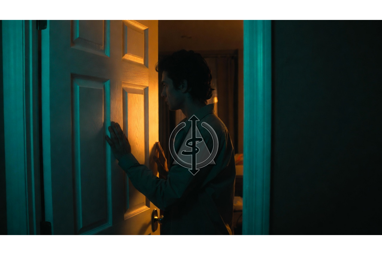 Person standing firmly in a doorway with warm light on their face and cooler light behind them, symbolizing choosing safety over other people's comfort.