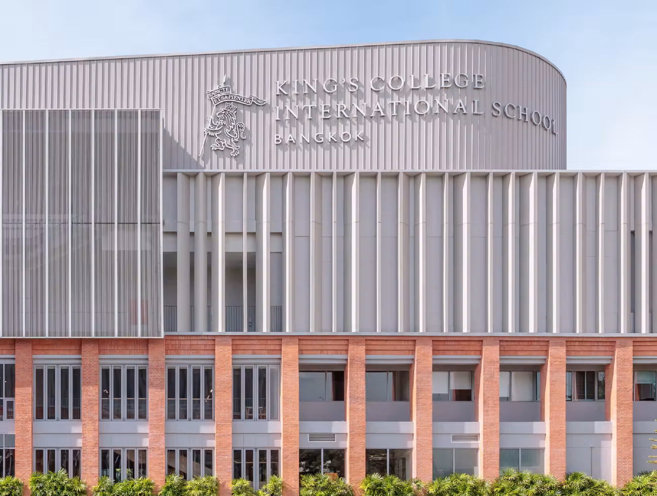 Facade of King’s College International School Bangkok with modern architecture and vertical elements.