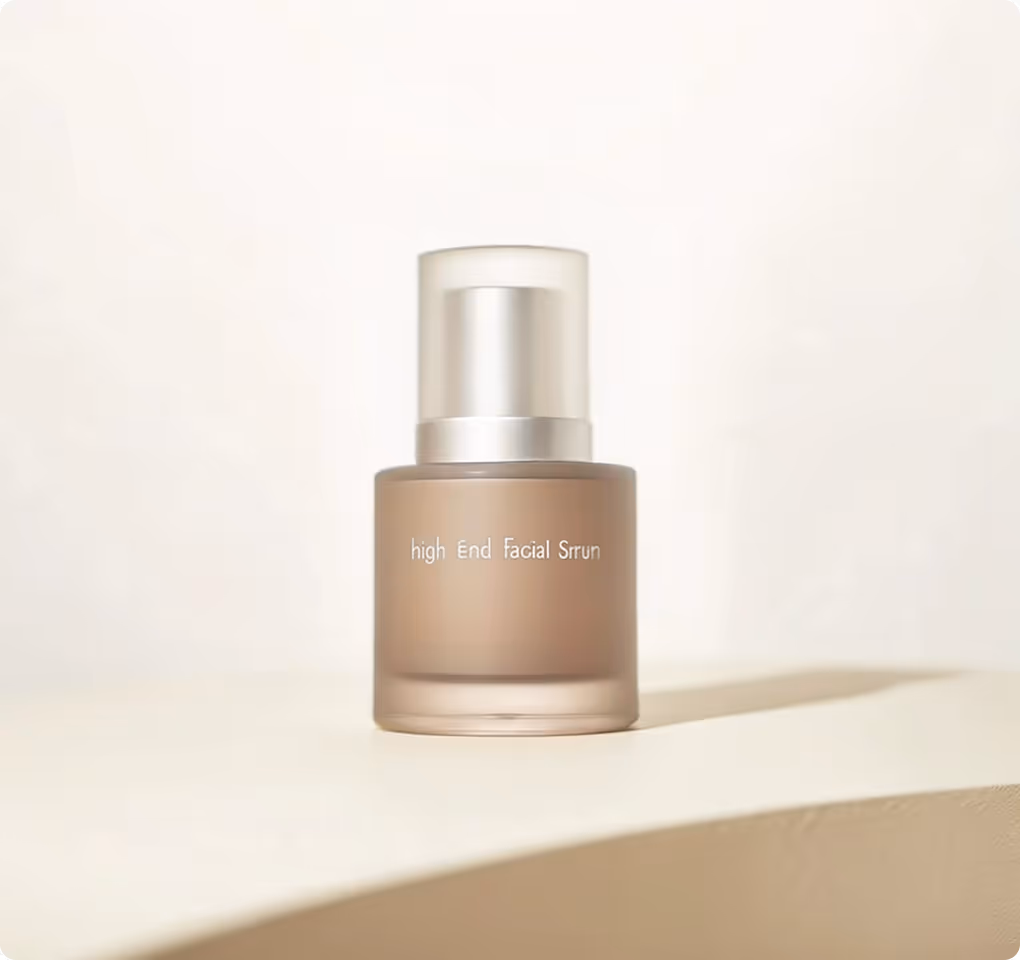 Frosted glass bottle of high-end facial serum with a pump dispenser on a light beige surface.
