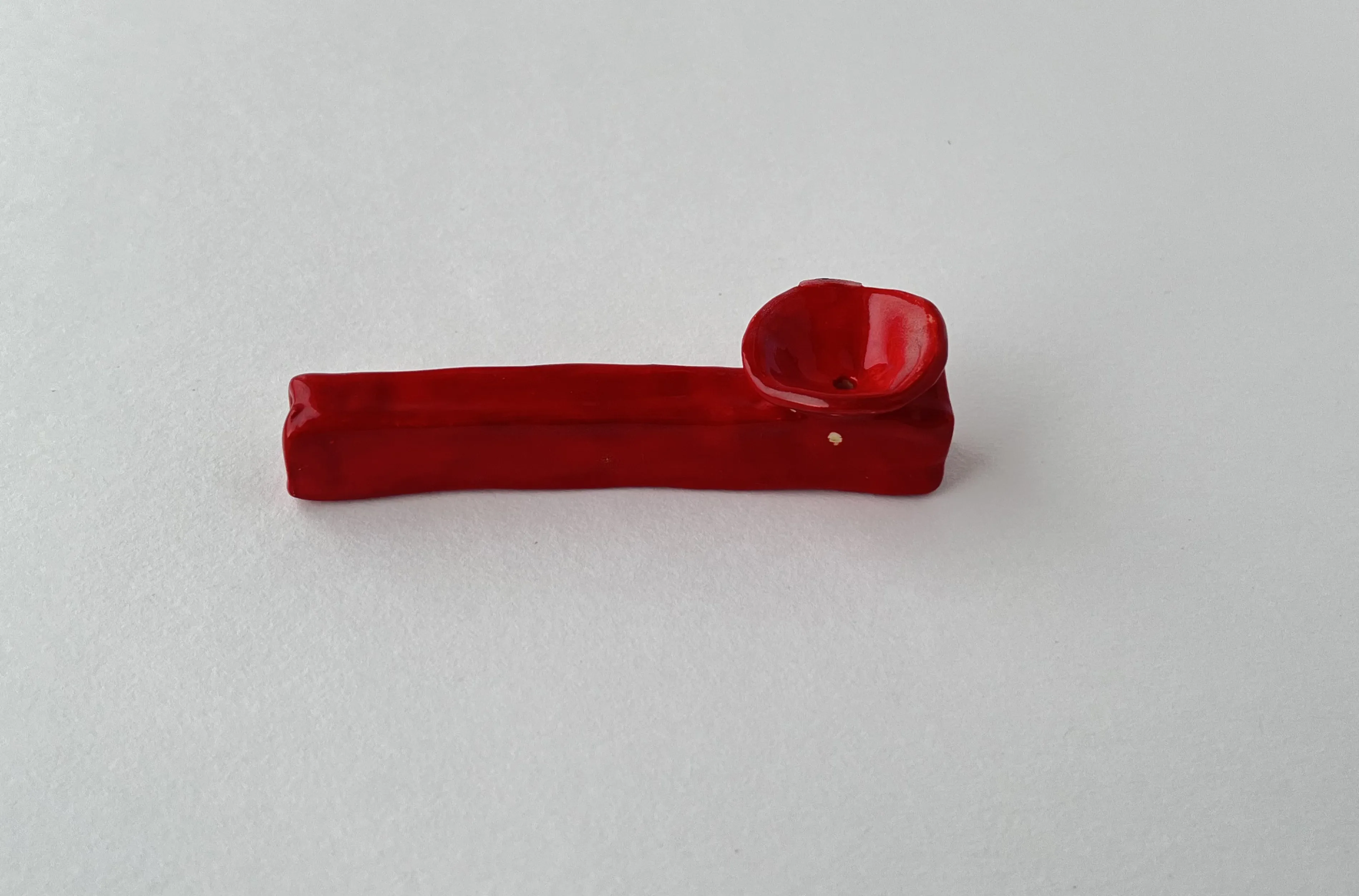 red small smoking pipe.