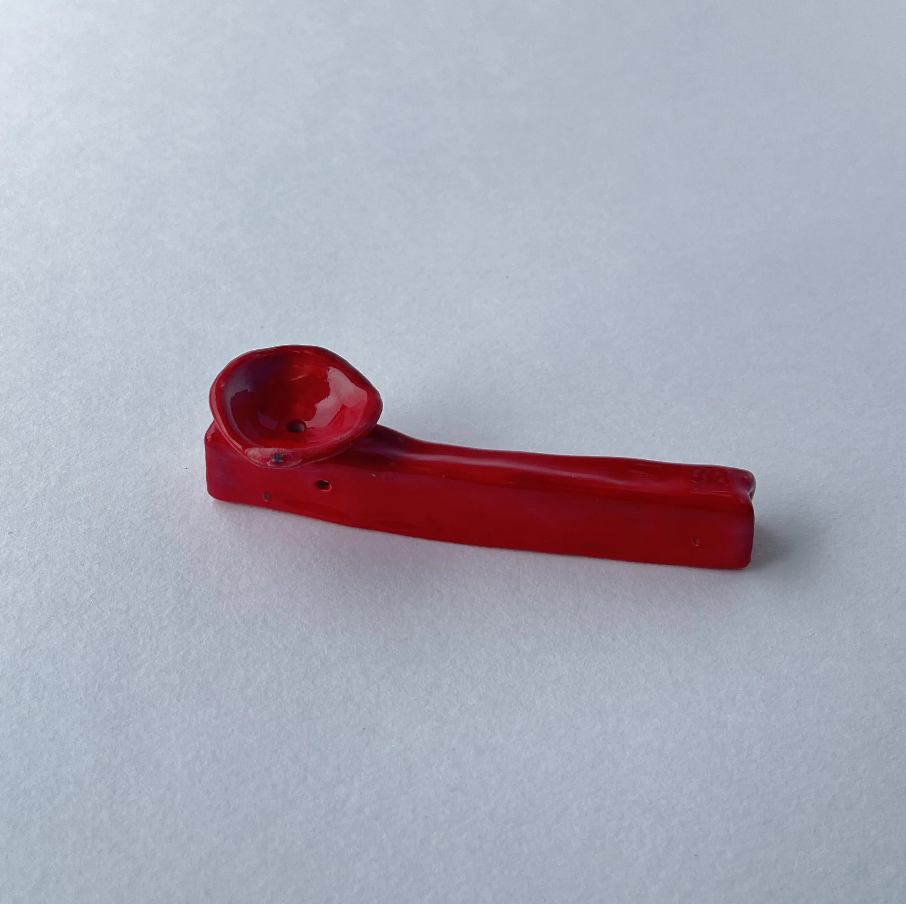red small smoking pipe.