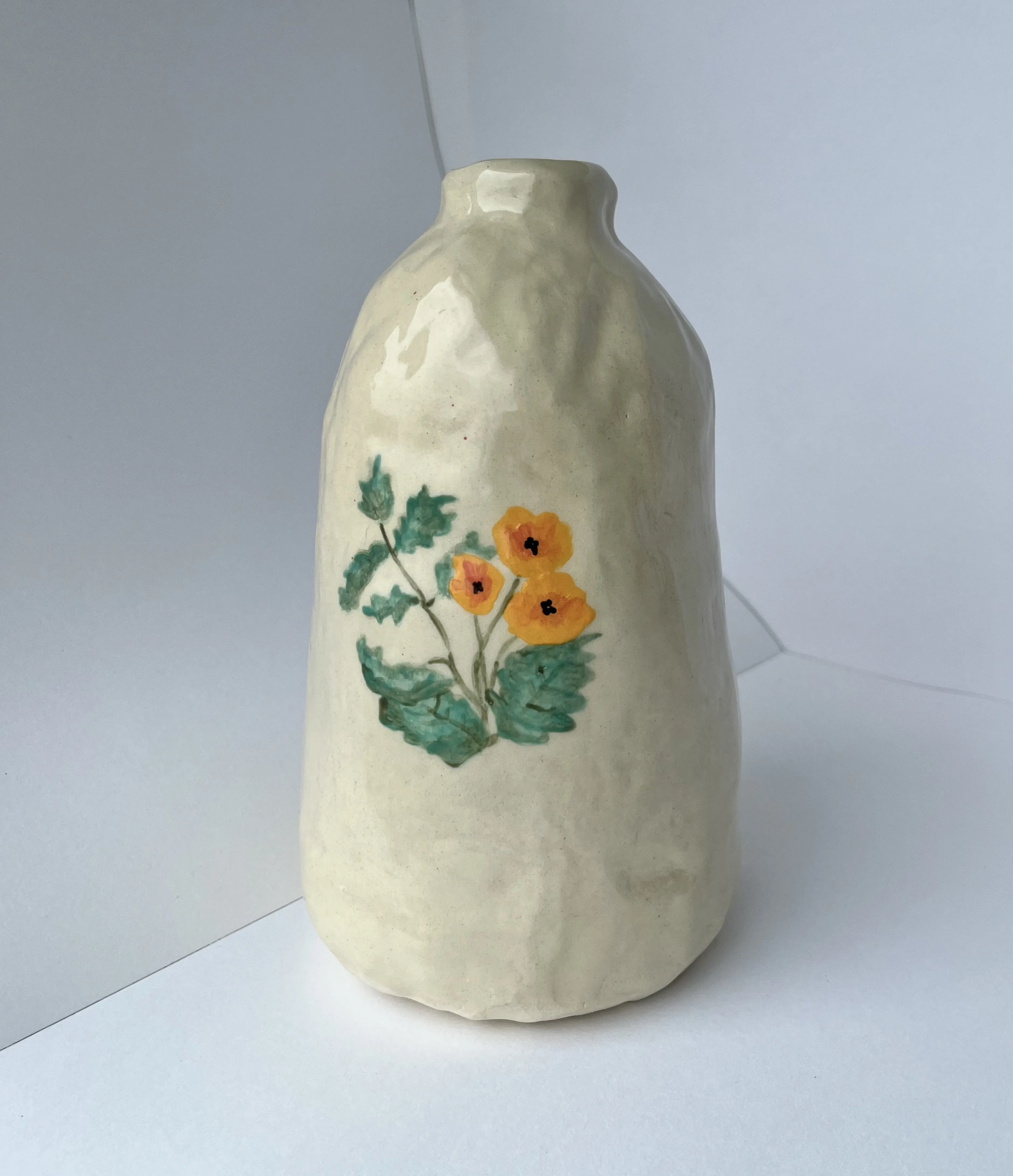 Flower vase with painted poppies.