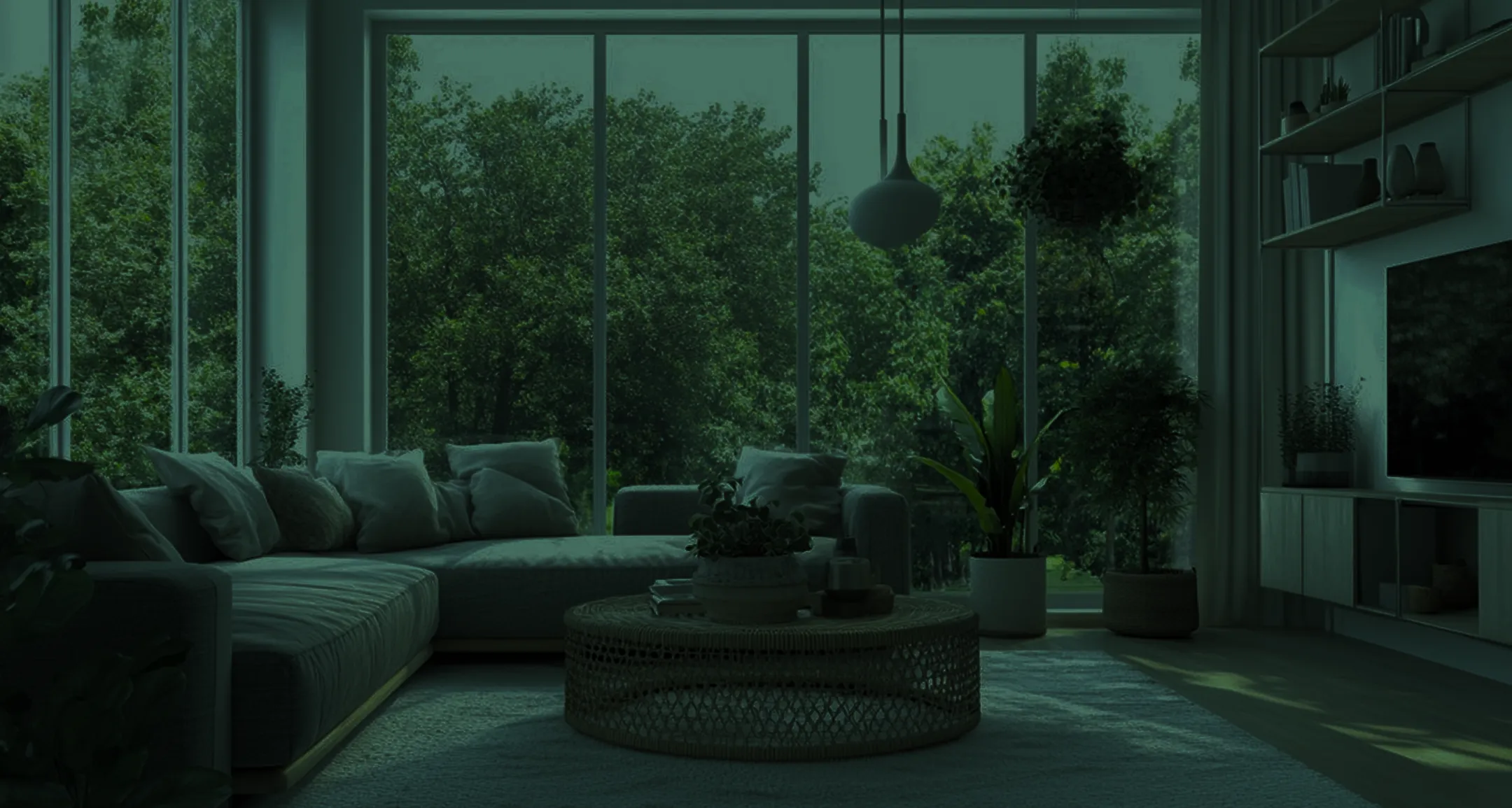 Modern living room with large windows, green plants, and minimalist design