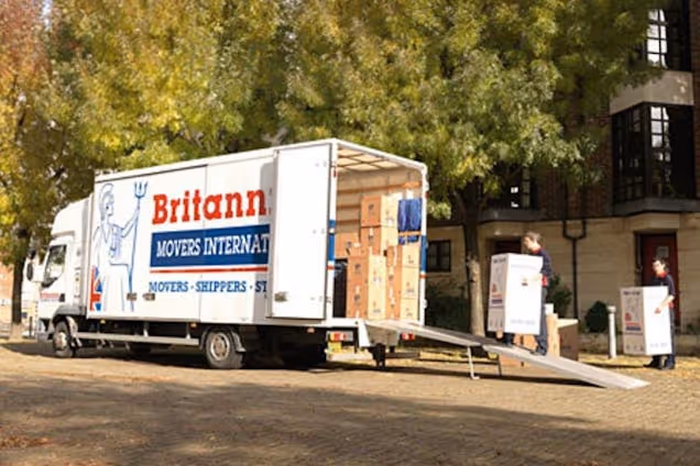 Britannia Lanes of Bristol Workers Moving Boxes into the Van