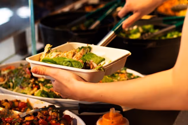 Farmer J staff serving the food